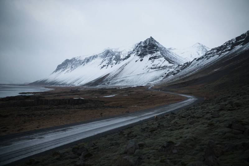 Driving near snowy mountain in Iceland