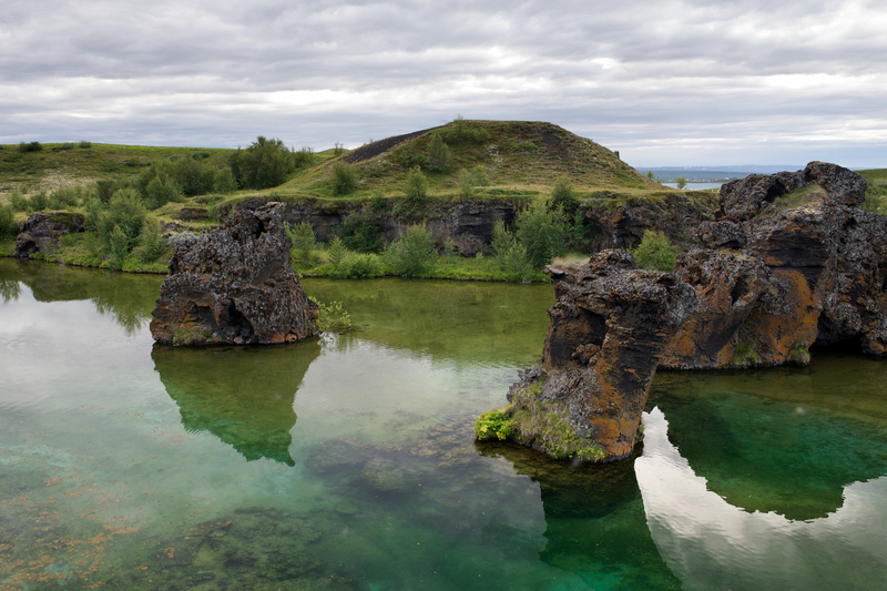 lake-myvatn-in-north-iceland-on-a-bright-summer-day-with-rock-formations-in-the-water